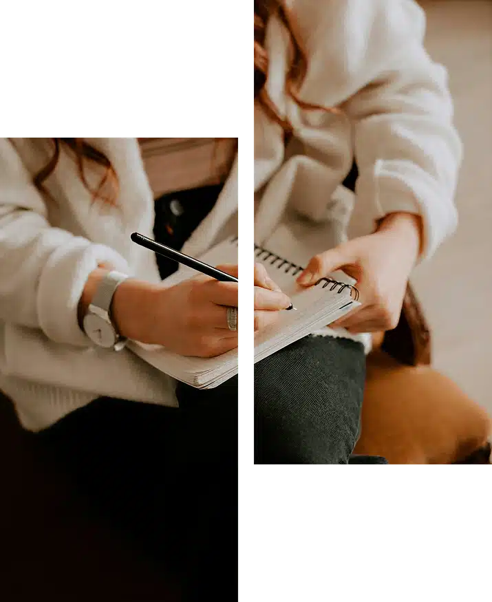 A person writes in a notebook.